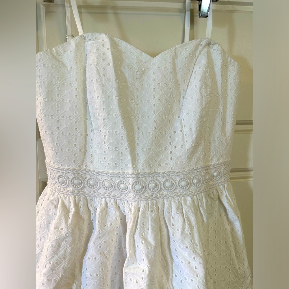 White beaded strapless dress.
